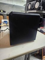 Front/side view of black cube subwoofer