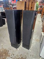 Front and side view of both Yamaha tower speakers showing height and design
