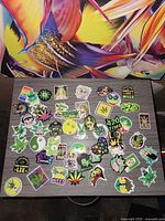 Overhead view of assorted cannabis themed stickers spread on table