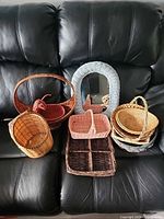 Group shot of all baskets and arched mirror on sofa