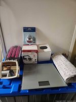 Lot overview showing all items on blue bin lid