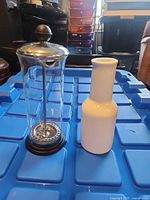 French press and ceramic decanter side by side