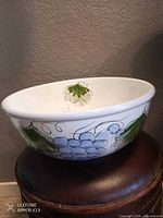 Side view of porcelain bowl showing grape design