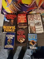 All six Stephen King books laid on table