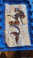 Full view of folded mermaid decal on blue tray
