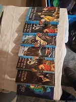 Seven Hardy Boys hardcover books laid out showing spines and cover art