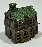 Front left view showing house shape, green roof, window cutouts