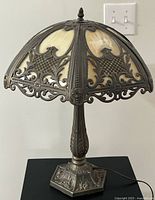 Full view of brass slag glass table lamp unlit