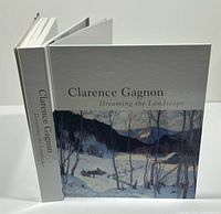 Front cover and spine of art book displayed upright and open