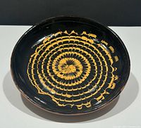 Top view showing spiral yellow on black design