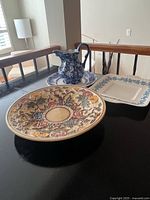 All four pieces grouped: square Wedgwood dish, round Lucerne dish, Indian Tree platter, blue floral jug