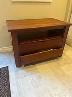 Front view showing open shelf and drawer fronts