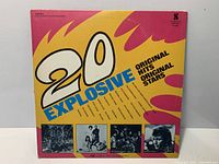 Front cover of 20 Explosive Original Hits LP showing title, artwork and artist thumbnails