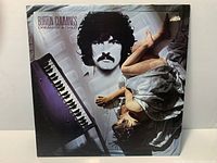 Front cover of Burton Cummings Dream of a Child LP showing artwork and condition