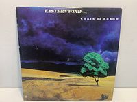 Front of Chris de Burgh Eastern Wind LP sleeve showing artwork and possible signature
