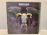 Front cover of Eagles “One of These Nights” LP showing artwork and wear