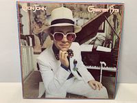 Front cover of Elton John Greatest Hits LP showing overall sleeve condition