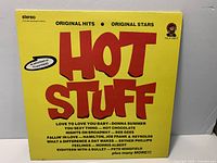 Front cover of Hot Stuff compilation vinyl LP showing title, artists and catalog number