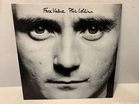 Front cover of the Phil Collins "Face Value" LP showcasing album artwork and condition