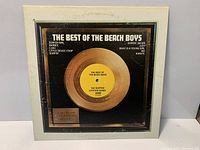 Front view of LP sleeve and record label visible through cutout