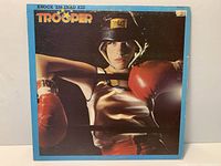 Front sleeve of Trooper Knock 'Em Dead Kid LP showing catalog and wear