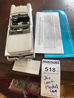 Overhead view of open-top model showing interior and detached steering wheel