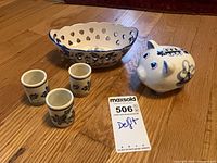 All five Delft pieces grouped for scale and ID tag visible