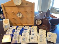 Group shot of boxed plates, wall rack, rotating rack