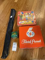 Group shot of bat case, both board games, small box presumed baseball