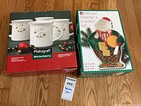 Both boxed sets side by side on floor