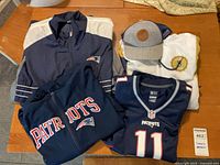 All five apparel items laid out on table