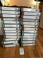 Two stacks of approximately 25 Great Courses CD sets showing all visible spines and titles