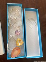 Necklace in box showing full pendant and chain
