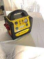 Front view showing control panel, gauges, work light, EllisDon branding