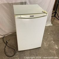 Front view of white compact refrigerator