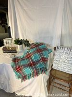 Overall lot with plaid throw, lantern, Home sign, planter and kitchen sign