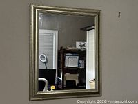 Mirror hung on wall showing full frame