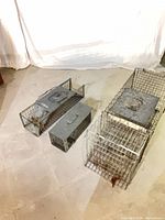 Three wire live trap cages in small, medium, large sizes