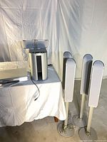 Overall view showing subwoofer with centre speaker on top, four tower speakers, and DVD receiver