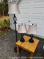 Full view of floor lamp and two table lamps