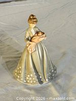 Full view of figurine front on neutral background