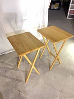 two wood folding TV tray tables front view