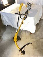 Full view of Ryobi CS26 gas curved-shaft string trimmer
