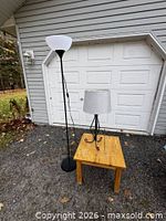 Full view of floor lamp and table lamp side by side outdoors