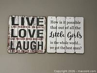 Both rustic wood plank signs side by side on wall