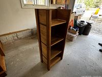 Full view of wood shelving unit front and side