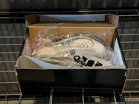 Shoes inside original Adidas box