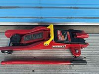 Overall view of Big Red hydraulic trolley jack and detachable handle