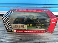 Front view of boxed Revell Mello Yello Pontiac #42 die-cast car