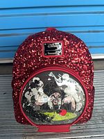 Front view of red sequin Disney Loungefly Snow White mini backpack